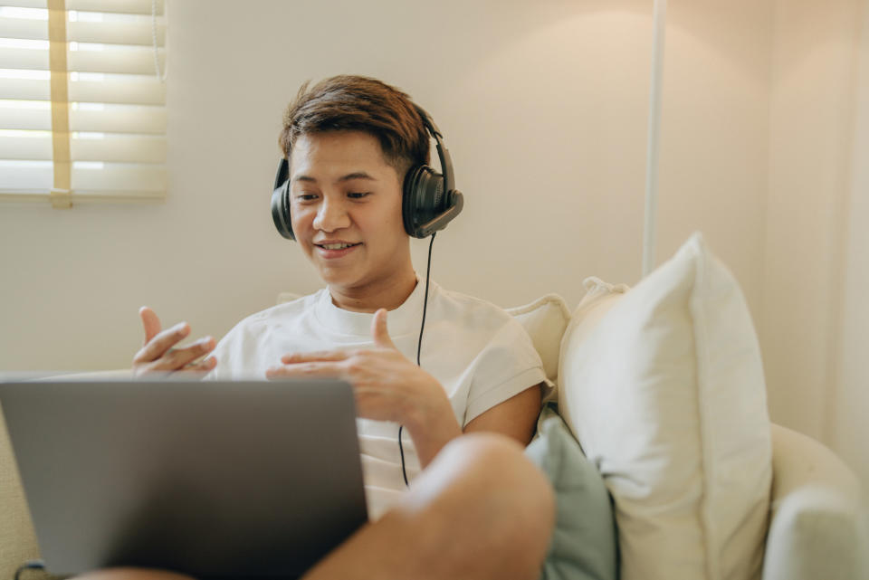 nonbinary person talking on a video call