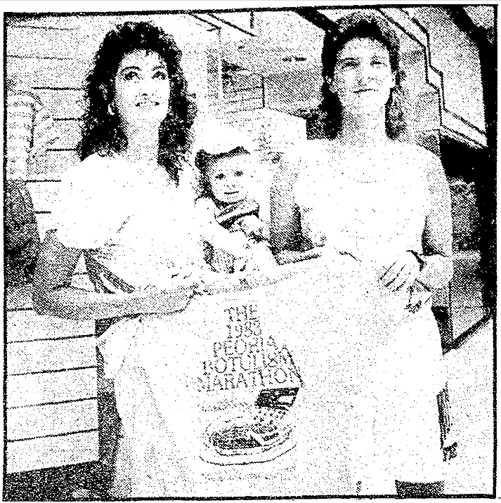 In this 1988 file photo, Tracy Dearing, left, and Mary Dobrydnia hold a T-shirt in front of the former Skewer Inn, now The Gap, in Northwoods Mall. Dearing is also holding her 13-month-old son, Sean. The T-shirt reads, "THE 1983 PEORIA BOTULISM MARATHON." Both women were victims of the outbreak.