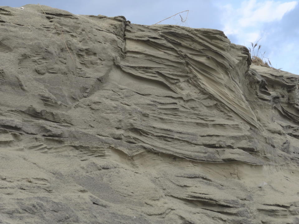 Lines cut into the sand dunes by erosion in North Wildwood N.J. are evident in this Jan. 5, 2023 photo. North Wildwood, which is defying a state order not to do emergency repairs to its eroded beach, is suing New Jersey for $21 million, asserting it has spent that amount trucking sand in to widen its beaches in the absence of a government beach replenishment project. (AP Photo/Wayne Parry)