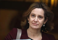 FILE - In this file photo dated Wednesday, March 14, 2018, Britain's Home Secretary Amber Rudd leaves 10 Downing Street in London. Rudd on Friday Nov. 16, 2018, has been named as Work and Pensions Secretary, as part of a major reshuffle of the ruling Conservative Party Cabinet, following recent resignations over the proposed Brexit split from Europe. (AP Photo/Frank Augstein, FILE)