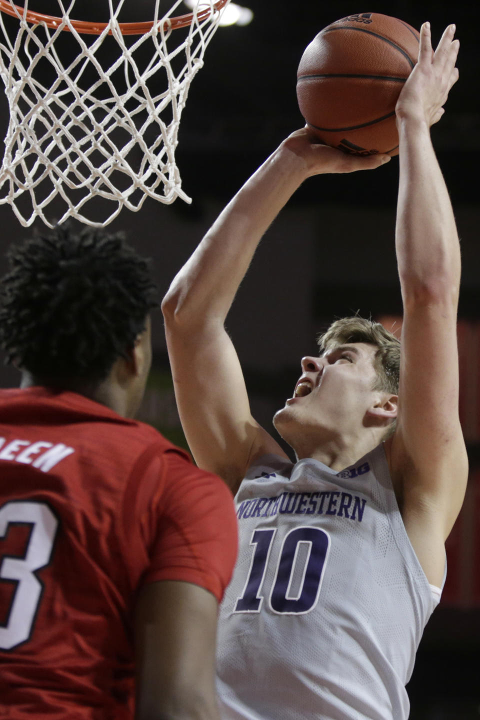 Northwestern's Miller Kopp (10) shoots against Nebraska's Jervay Green (23) during the second half of an NCAA college basketball game in Lincoln, Neb., Sunday, March 1, 2020. (AP Photo/Nati Harnik)