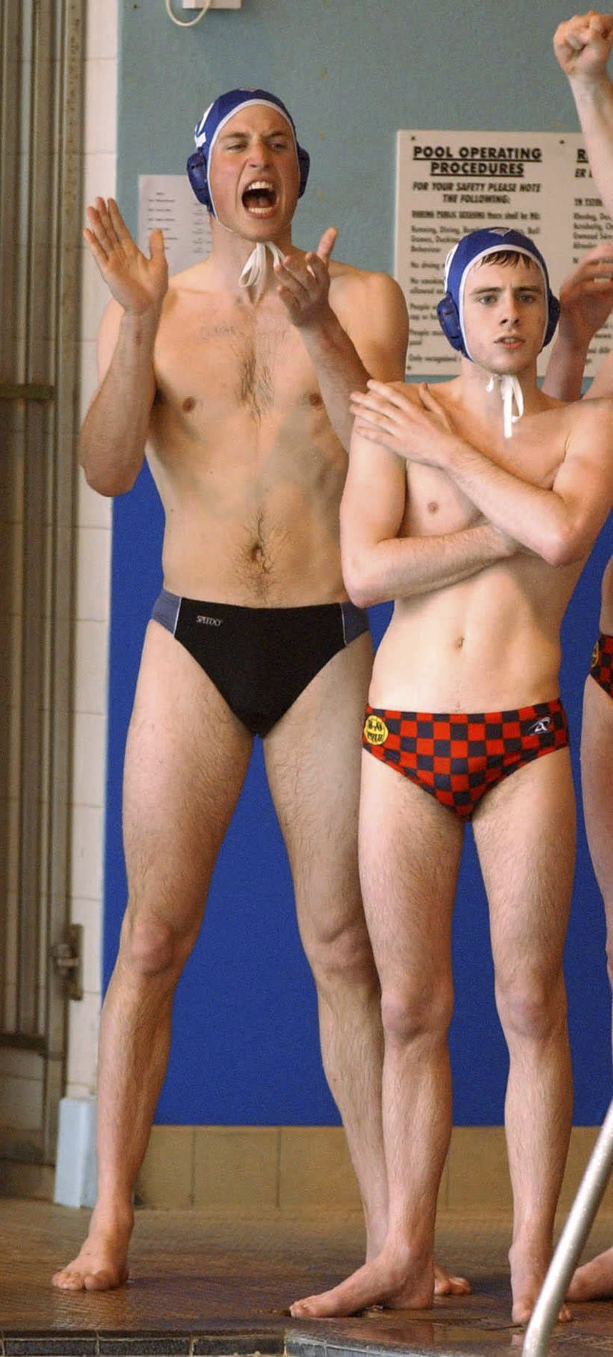 FILE Britain's Prince William, left, cheers as he makes his water polo debut for the Scottish national universities squad in the annual Celtic Nations tournament against Wales and Ireland in Cardiff, Wales, Saturday, April 17, 2004. The world watched as Prince William grew from a towheaded schoolboy to a dashing air-sea rescue pilot to a father of three. But as he turns 40 on Tuesday, June 21, 2022, William is making the biggest change yet: assuming an increasingly central role in the royal family as he prepares for his eventual accession to the throne. (Barry Batchelor, Pool via AP, File)