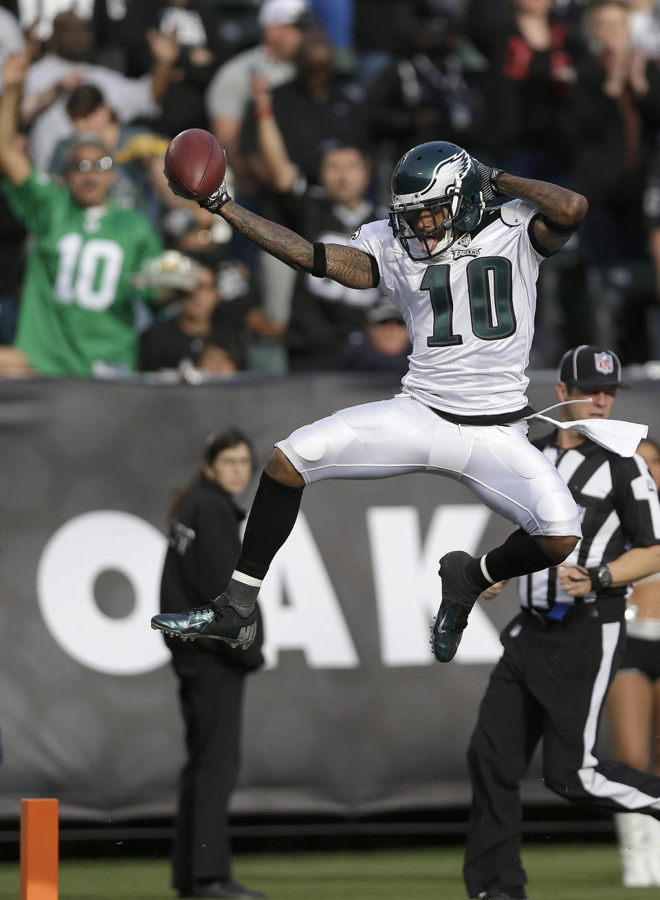 FILE - In this Nov. 3, 2013 file photo, Philadelphia Eagles wide receiver DeSean Jackson (10) celebrates as he scores on a 46-yard touchdown pass from quarterback Nick Foles during the third quarter of an NFL football game against the Oakland Raiders in Oakland, Calif. The Washington Redskins made their biggest move yet of the offseason Tuesday night, April 1, 2014, adding three-time Pro Bowl receiver DeSean Jackson less than a week after the dynamic playmaker was released by the rival Philadelphia Eagles. (AP Photo/Marcio Jose Sanchez, File)