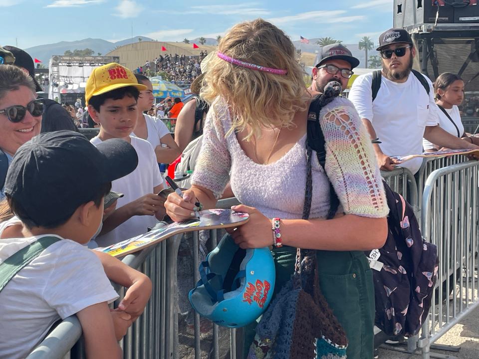 Surfer turned skater Bryce Wettstein takes the time to sign autographs for fans after finishing sixth in the Women's Skateboarding Vert Finals at the X Games in Ventura on Saturday.