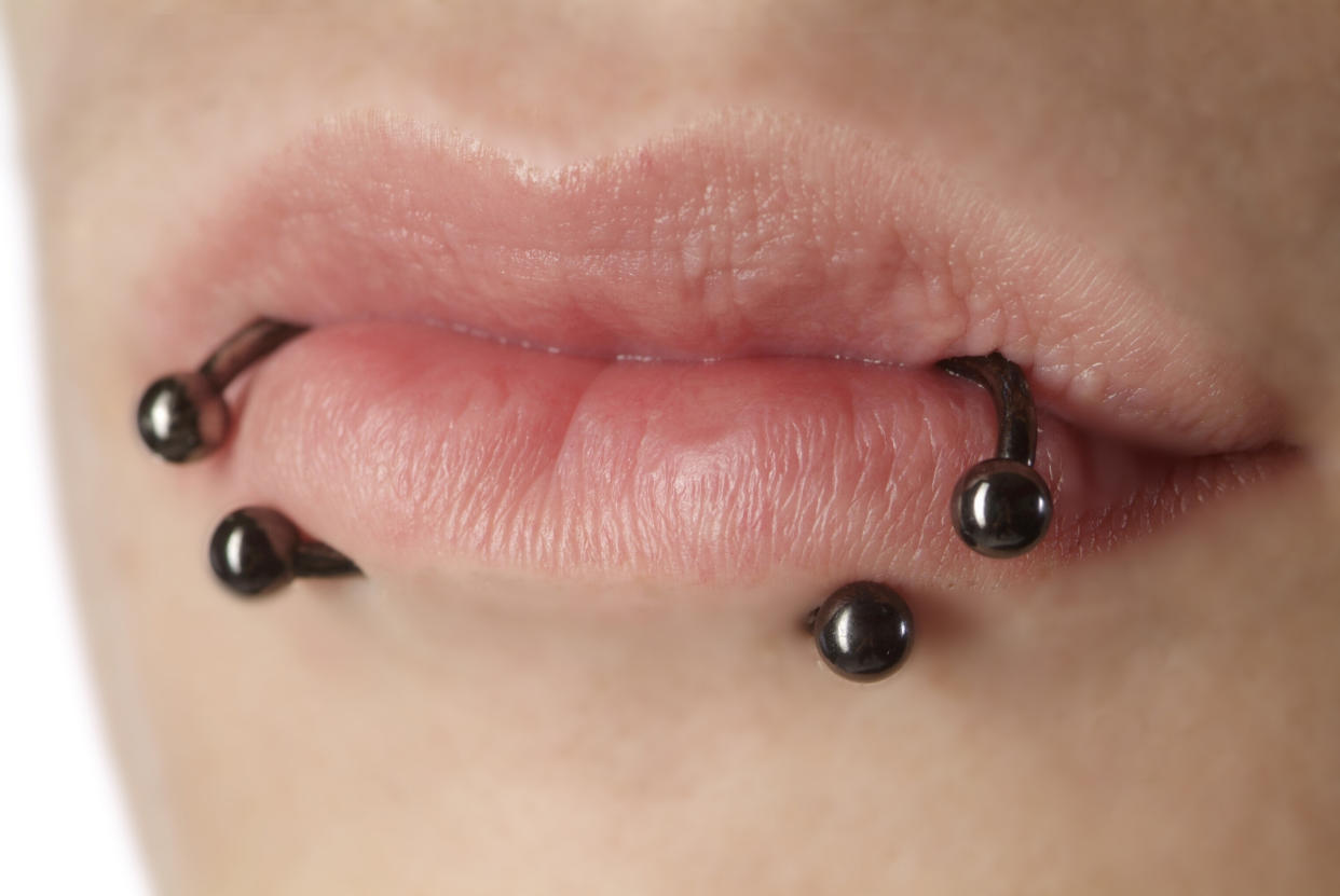 close up from a lip of a woman with piercing