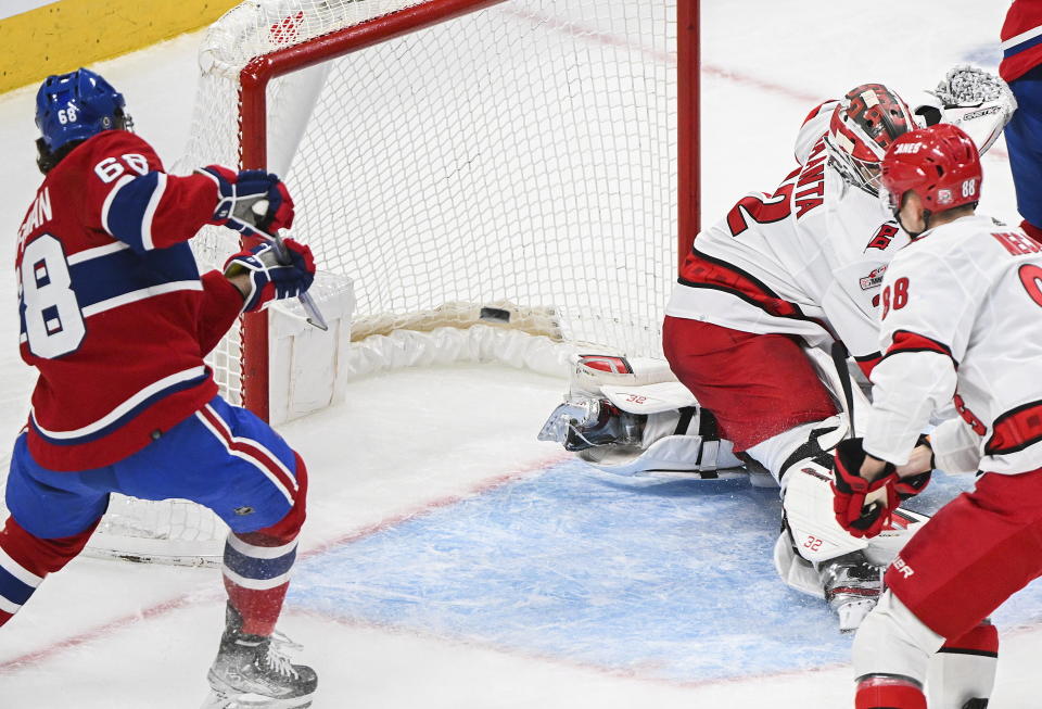 Montreal Canadiens' Mike Hoffman (68) scores against Carolina Hurricanes goaltender Antti Raanta during the first period of an NHL hockey game Tuesday, March 7, 2023, in Montreal. (Graham Hughes/The Canadian Press via AP)