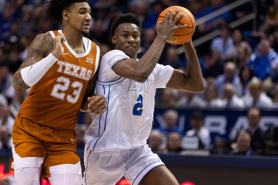 BYU guard Jaxson Robinson (2) drives the ball against Texas forward Dillon Mitchell (23) during their game in Provo on Saturday, Jan. 27, 2024. BYU won 84-72.