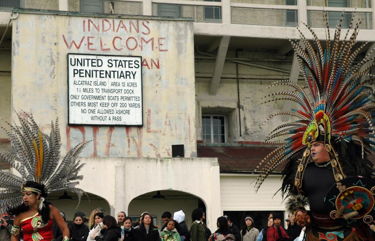 The Teo Kali, an Aztec cultural group, participates in a sunrise "Unthanksgiving Day" ceremony with Native Americans on Nov. 24, 2005, on Alcatraz Island. <a href="https://www.gettyimages.com/detail/news-photo/san-francisco-united-states-the-teo-kali-aztec-cultural-news-photo/56269934" rel="nofollow noopener" target="_blank" data-ylk="slk:Kara Andrade/AFP via Getty Images;elm:context_link;itc:0;sec:content-canvas" class="link "> Kara Andrade/AFP via Getty Images</a>