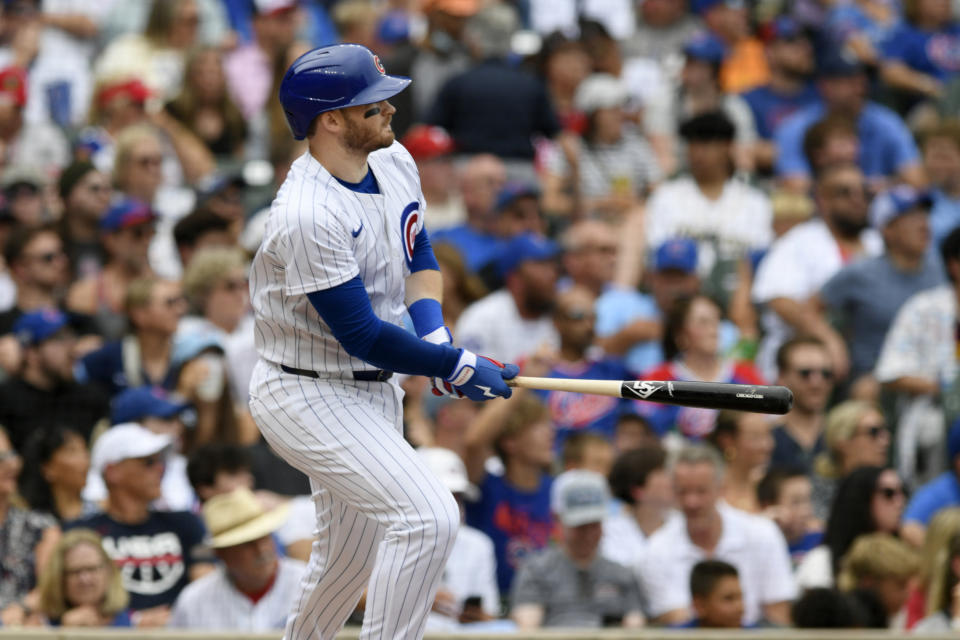 Chicago Cubs' Ian Happ watches his three-run home run during the fourth inning of a baseball game against the Philadelphia Phillies, Thursday, July 4, 2024, in Chicago. (AP Photo/Paul Beaty)