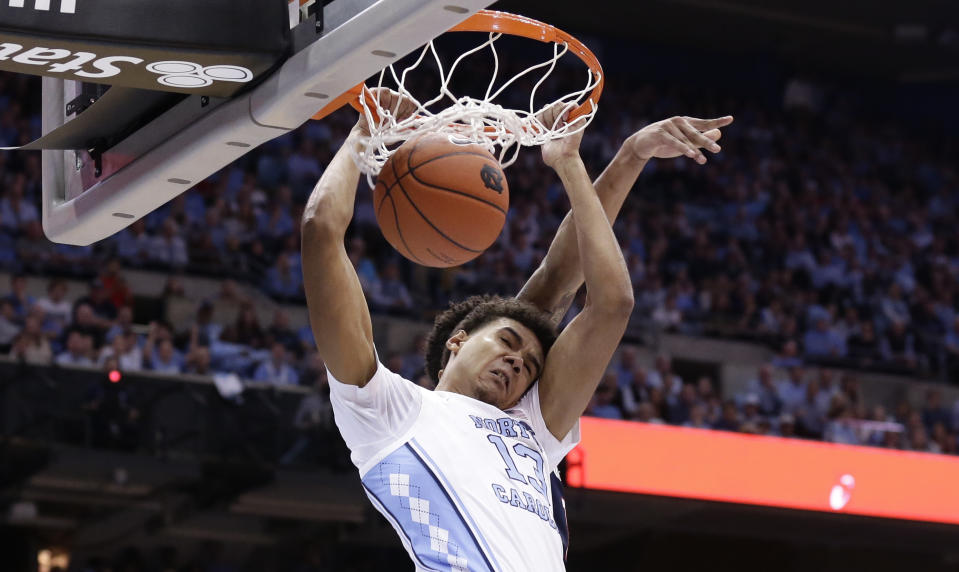 FILE - In this Dec. 15, 2018, file photo, North Carolina's Cameron Johnson (13) dunks against Gonzaga during the first half of an NCAA college basketball game, in Chapel Hill, N.C. Johnson was named to the AP All-ACC team, Tuesday, March 12, 2019.(AP Photo/Gerry Broome, File)