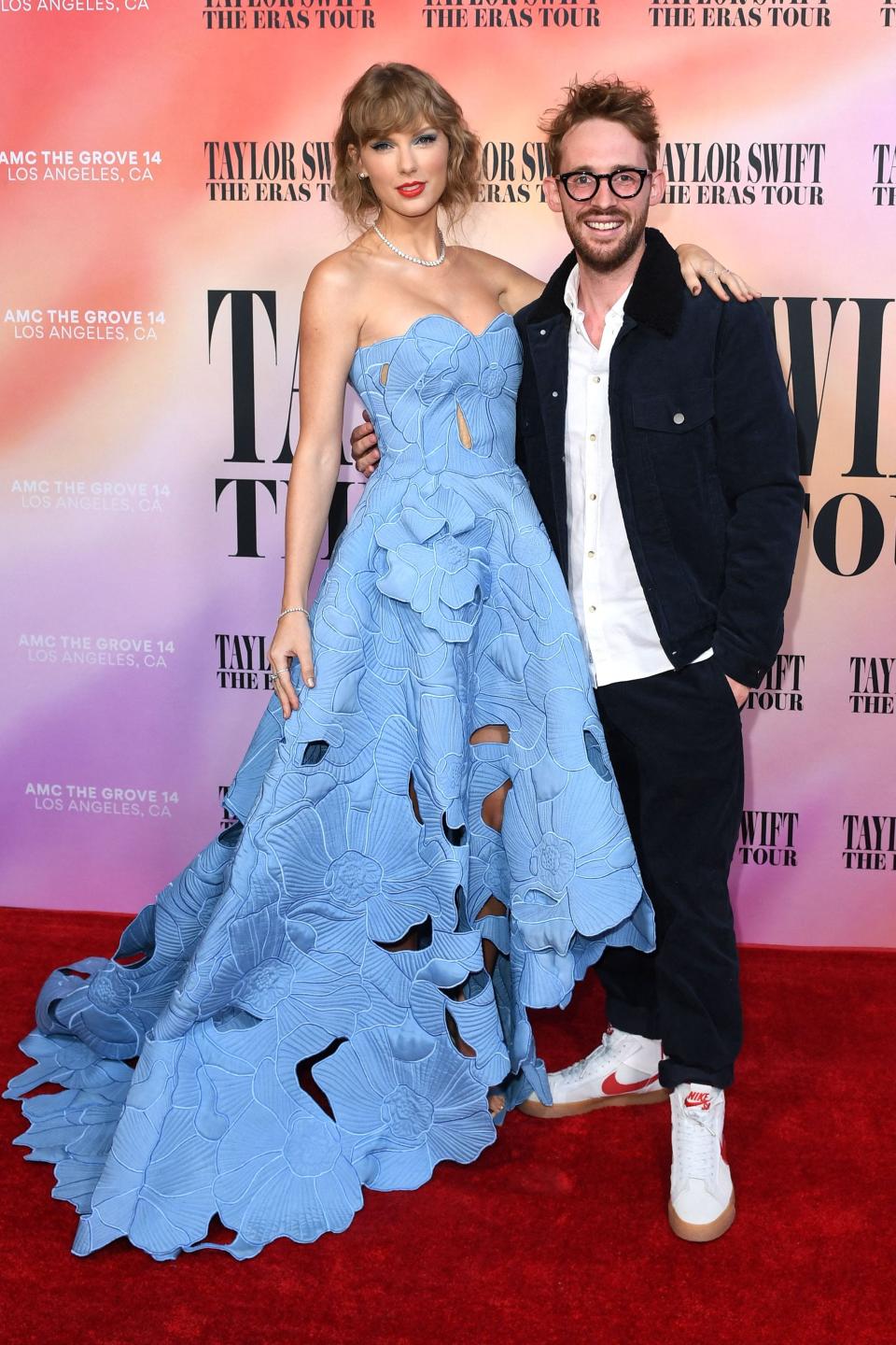 Taylor Swift and filmmaker Sam Wrench arrive for the "Taylor Swift: The Eras Tour" concert movie world premiere in Los Angeles, California on October 11, 2023.