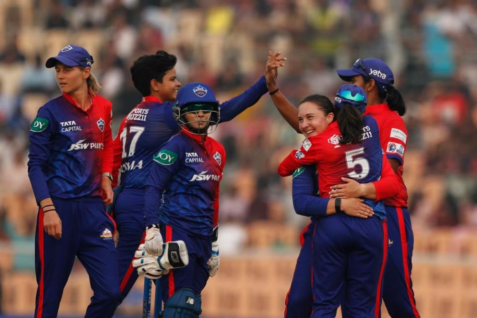 The Delhi Capitals celebrate a wicket against Royal Challengers Bangalore.