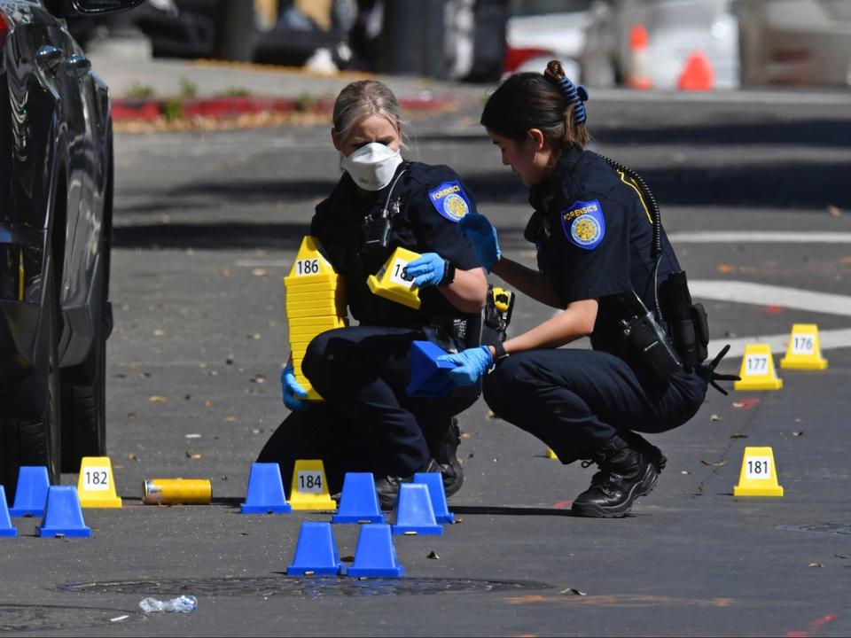 Investigators at the scene of the shooting in Sacramento, California (AP)