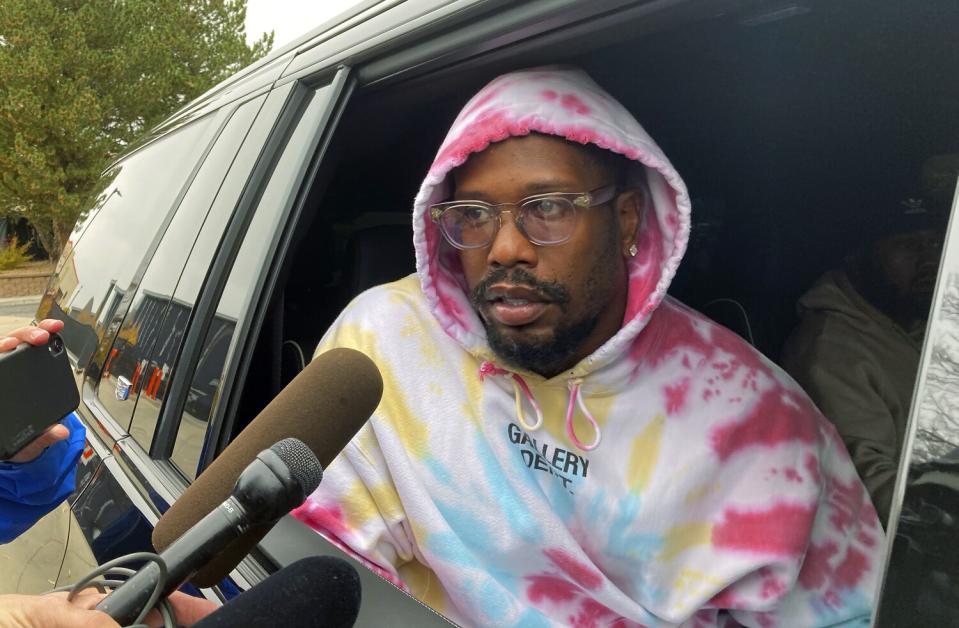 Former Denver linebacker Von Miller stops to talk to reporters outside the Broncos headquarters after he was traded.