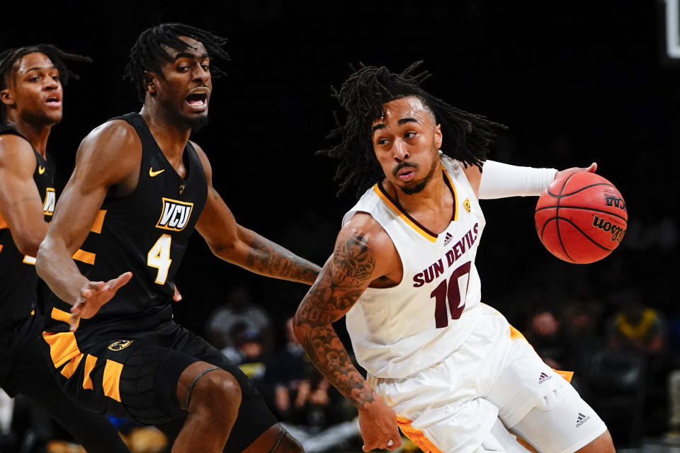 Arizona State's Frankie Collins (10) drives past Virginia Commonwealth's Jalen DeLoach (4) during the first half of an NCAA college basketball game at the Legends Classic Wednesday, Nov. 16, 2022, in New York. (AP Photo/Frank Franklin II)