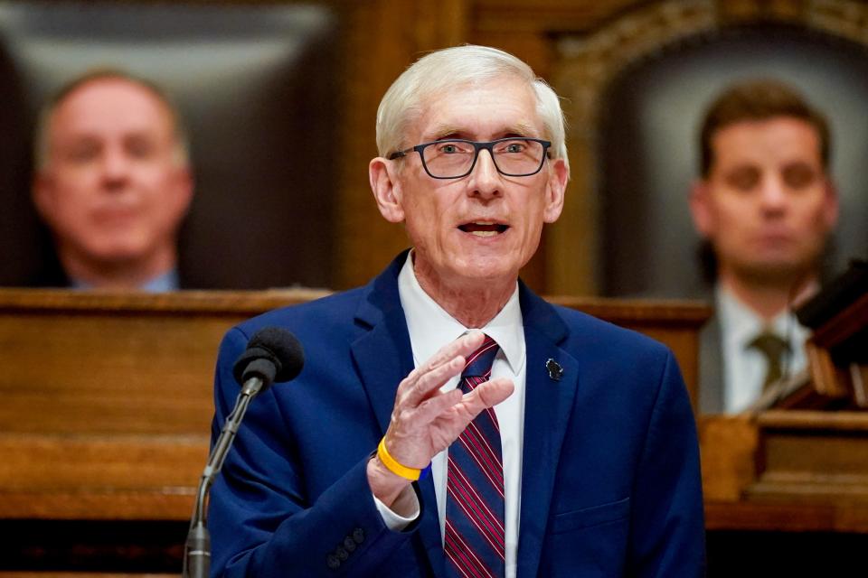 Wisconsin Gov. Tony Evers speaks at a pulpit.
