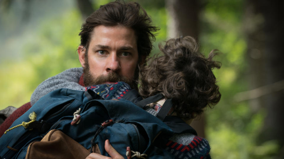 John Krasinski running with a kid in A Quiet Place