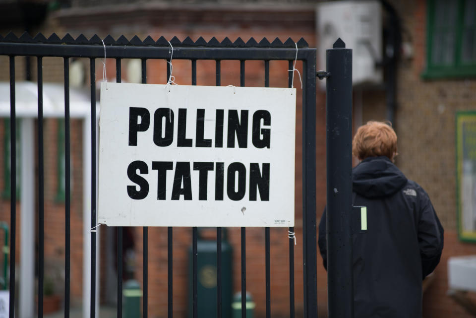 Welwyn Garden City, UK - June 8, 2017: Polling station sings during an election in the UK. A man can be seen entering the polling station was in Welwyn Garden City during the UK 8 June 2017 election.