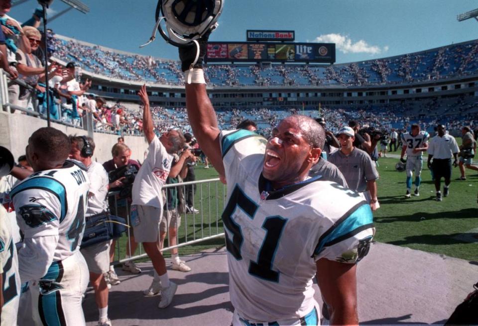 In 1996, Sam Mills celebrates with the crowd as he leaves the field following Carolina’s 23-7 upset win over the San Francisco 49ers.