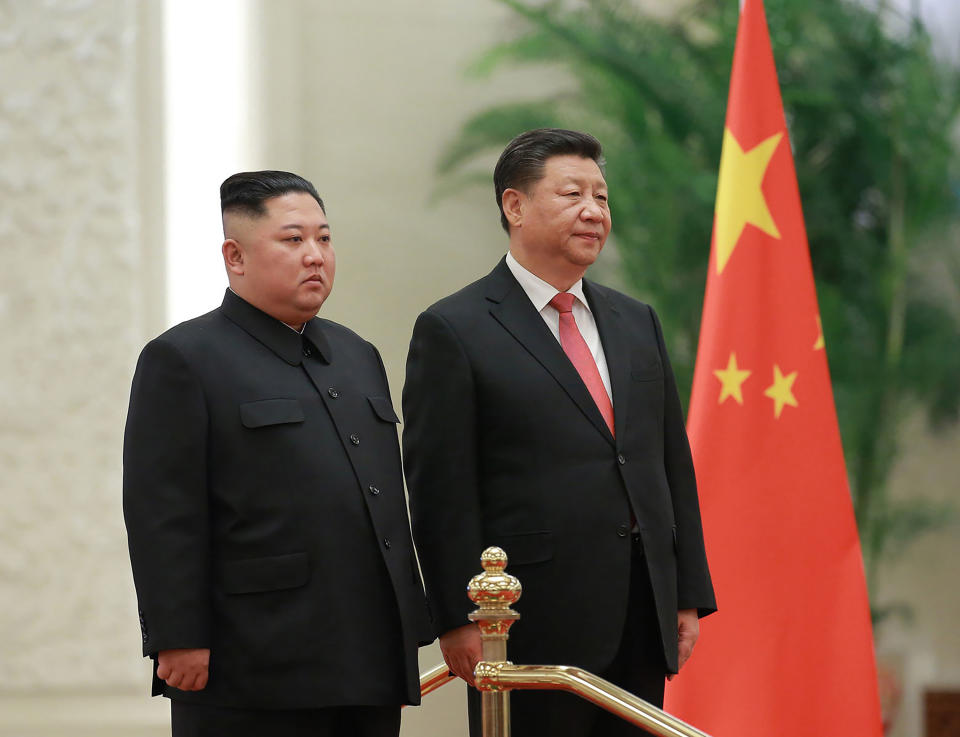 FILE - In this Jan. 8, 2019, file photo provided by the North Korean government, North Korean leader Kim Jong Un, left, and Chinese President Xi Jinping attend a welcome ceremony at the Great Hall of the People in Beijing. Xi said North Korea is taking the "right direction" by politically resolving issues on the Korean Peninsula in a rare op-ed published by a North Korean state newspaper Wednesday, June 19, 2019, a day before Xi visits Pyongyang to meet Kim. (Korean Central News Agency/Korea News Service via AP, File)