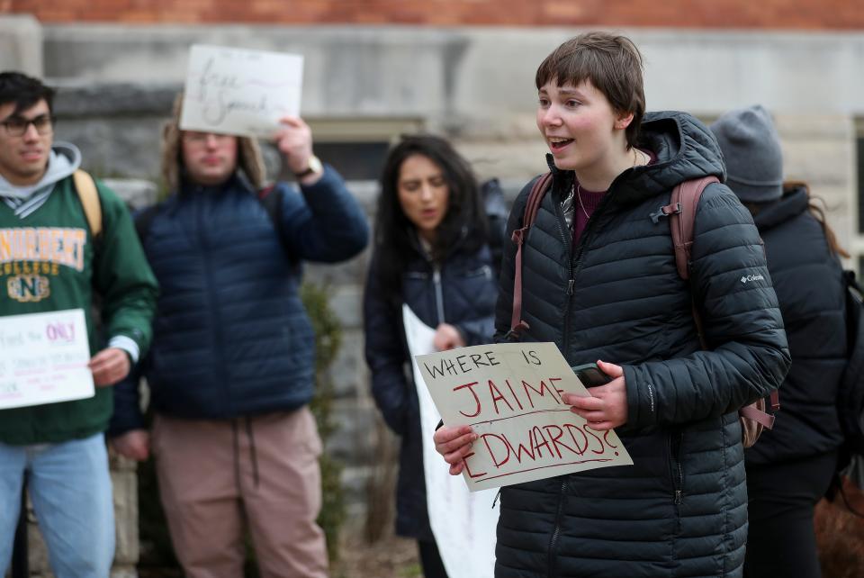 St. Norbert College junior Brooklyn Filtzkowski addresses fellow protestors Wednesday at the college. Students turned out to protest recently announced layoffs at the school.