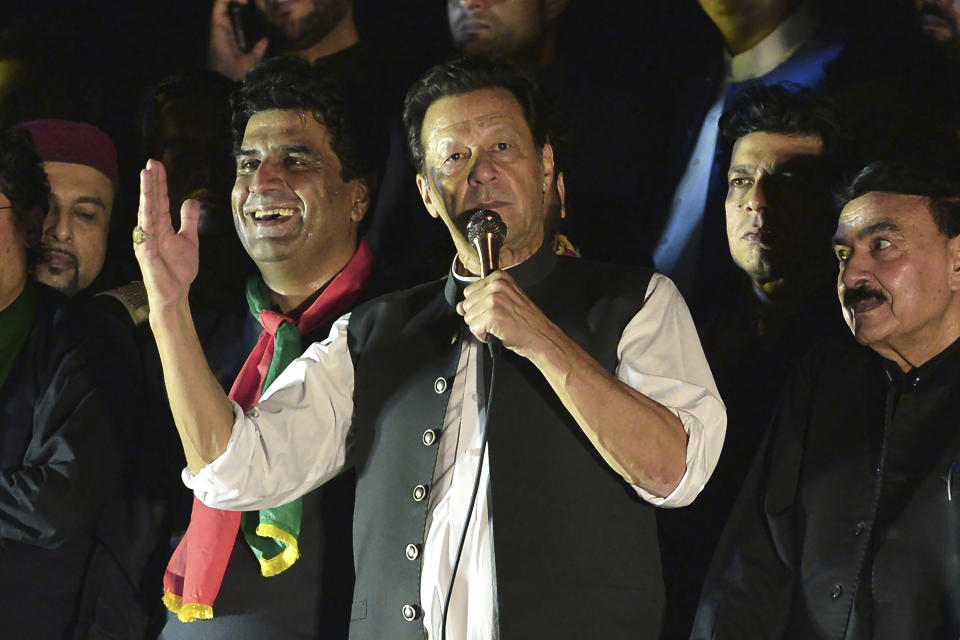 FILE - Pakistan's former Prime Minister Imran Khan, center, addresses during an anti-government rally in Islamabad, Pakistan, Saturday, Aug. 20, 2022. Pakistan's elections commission on Friday, Oct. 21, 2022, disqualified Khan on charges of concealing assets, a move which is likely to deepen lingering political turmoil. (AP Photo/W.K. Yousafzai, File)