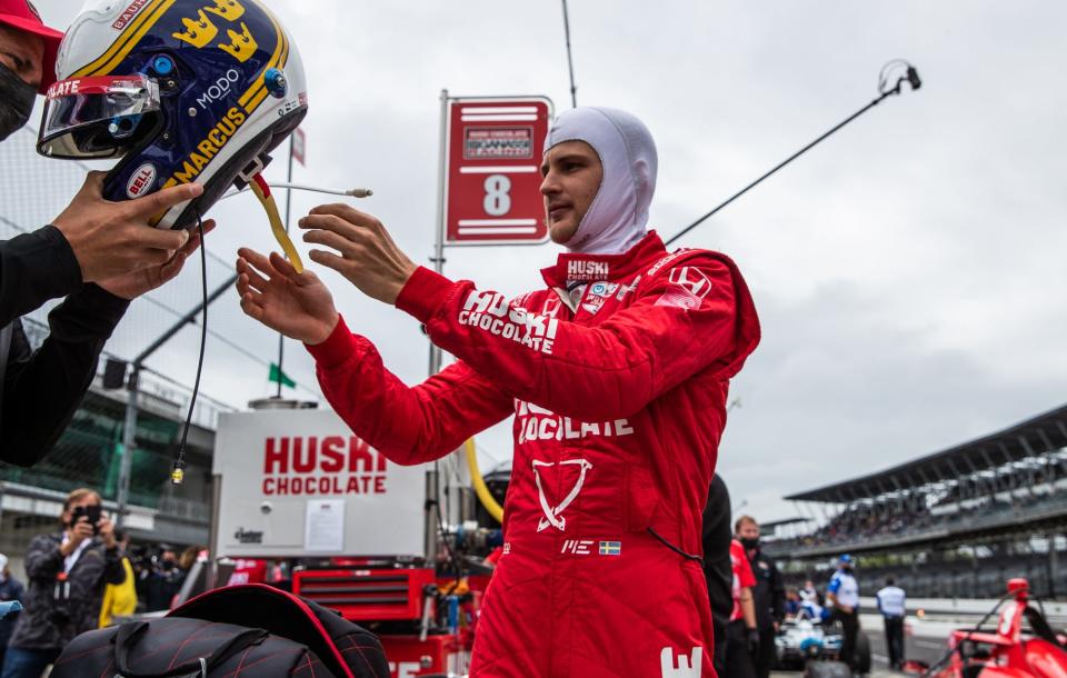 Chip Ganassi Racing driver Marcus Ericsson (8) gets his helmet on in preparation for practice Friday, May 28, 2021, during Carb Day at Indianapolis Motor Speedway.