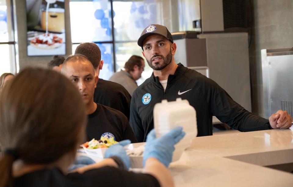 Franchise owner Jerry Ajlouny, right, talks with servers at Nick the Greek restaurant in Riverbank, Calif., Tuesday, September 12, 2023. Andy Alfaro/aalfaro@modbee.com