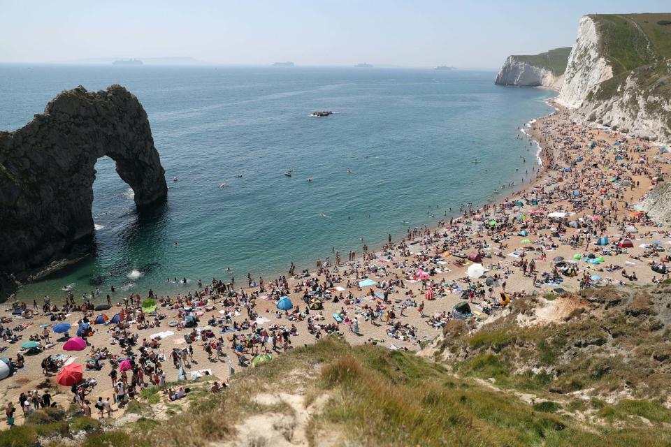 Durdle Door beach was packed out on Saturday (PA)