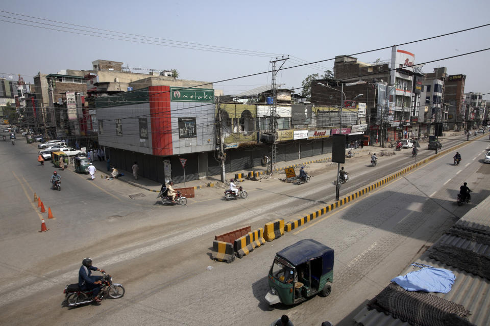 Pakistani shopkeepers close their businesses during strike against inflation in Peshawar, Pakistan, Saturday, Sept. 2, 2023. Pakistani traders on Saturday went on strike against the soaring cost of living, including higher fuel and utility bills and record depreciation of the rupee against the dollar, which has led to widespread discontent among the public. (AP Photo/Muhammad Sajjad)