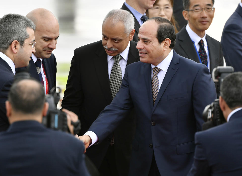 Egyptian President Abdel Fattah el-Sisi, center, arrives at Kansai International Airport in Izumisano, Osaka prefecture, western Japan, Thursday, June 27, 2019. Group of 20 leaders gather in Osaka on June 28 and 29 for their annual summit.(Nobuki Ito/Kyodo News via AP)