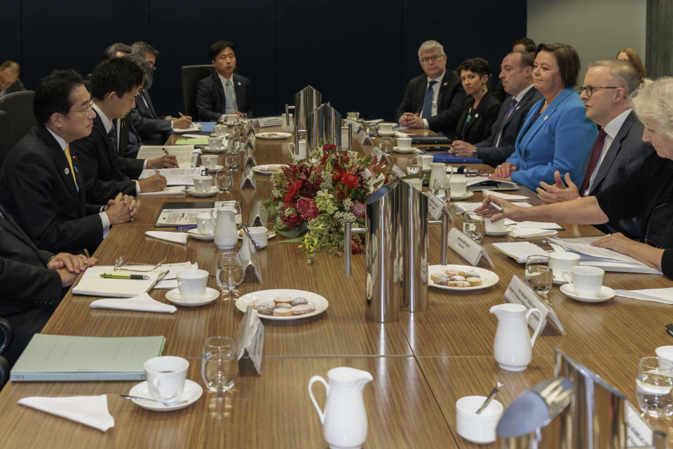 Japan's Prime Minister Fumio Kishida, left, holds talks with Australian Prime Minister Anthony Albanese in Perth, Australia, Saturday, Oct. 22, 2022. Kishida is on a visit to bolster military and energy cooperation between Australia and Japan amid their shared concerns about China. (Richard Wainwright/Pool Photo via AP)