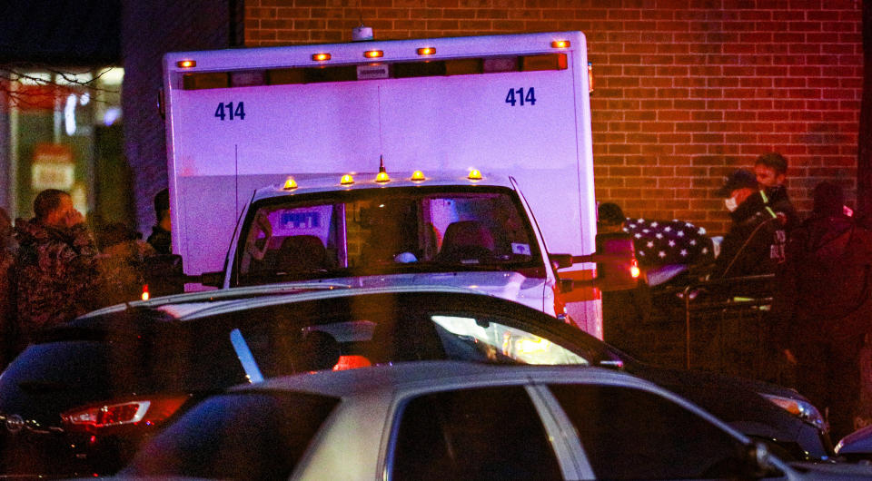 A flag-covered gurney is wheeled to an ambulance outside a King Soopers grocery store, late Monday, March 22, 2021, in Boulder, Colo., where authorities say multiple people were killed in a shooting. (AP Photo/Joe Mahoney)