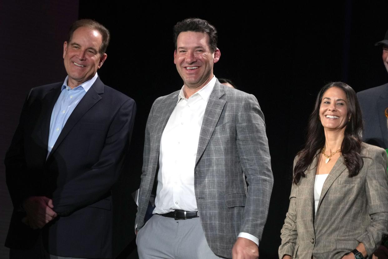 Feb 6, 2024; Las Vegas, NV, USA; CBS Sports analyst Tony Romo (center), poses with play-by-play announcer Jim Nantz (left) and sideline reporter Tracy Wolfson at a press conference at the Super Bowl 58 Media Center.