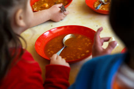 Children have bean soup for lunch at the Model National Nursery of Kallithea, in Athens, Greece, March 3, 2017. REUTERS/Alkis Konstantinidis