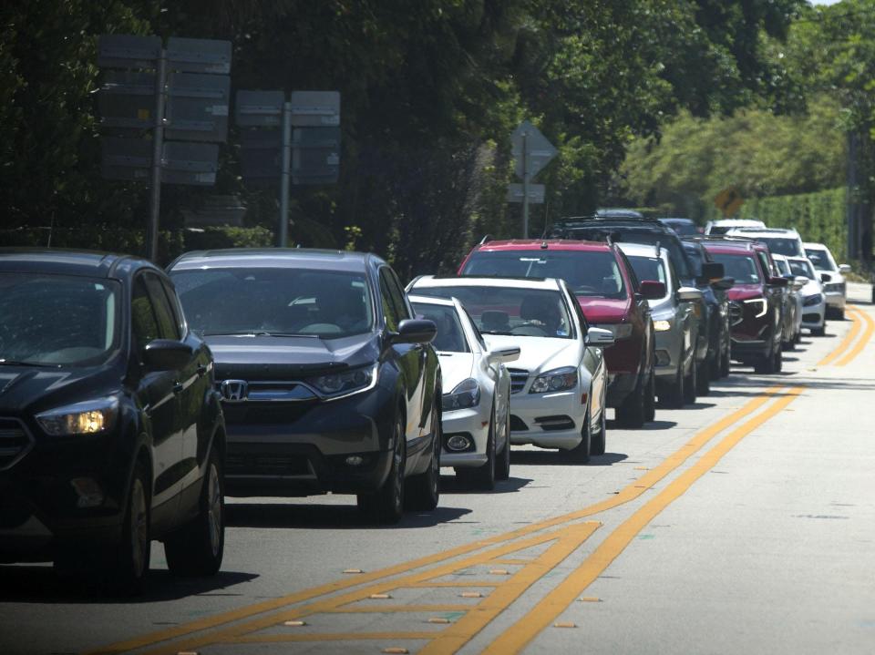 Traffic backs up on South Ocean Boulevard as President Donald Trump's motorcade returns to Mar-a-Lago during a recent visit. {BRUCE R. BENNETT/palmbeachpost.com}