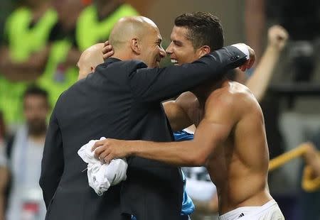 Soccer Football - Atletico Madrid v Real Madrid - UEFA Champions League Final - San Siro Stadium, Milan, Italy - 28/5/16 Real Madrid's Cristiano Ronaldo celebrates with coach Zinedine Zidane after winning the penalty shootout and the UEFA Champions League Final Action Images via Reuters / Carl Recine Livepic