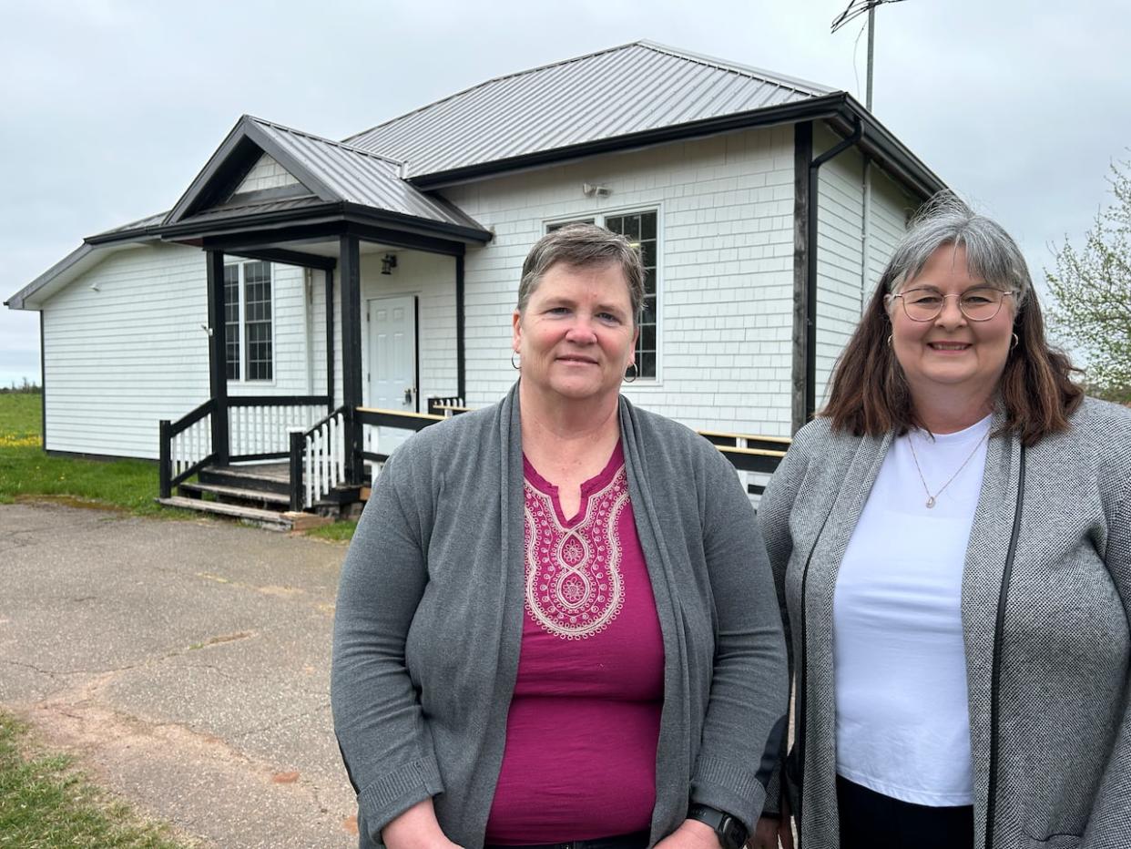 Karen MacLeod, left, and Susan Shaw are part of the non-profit group that helped keep the former Lorne Valley schoolhouse as a community hub. (Stacey Janzer/CBC - image credit)
