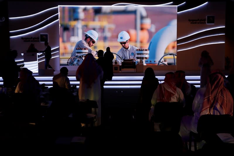 Attendees wait for the start of a news conference by Saudi Aramco in Dhahran