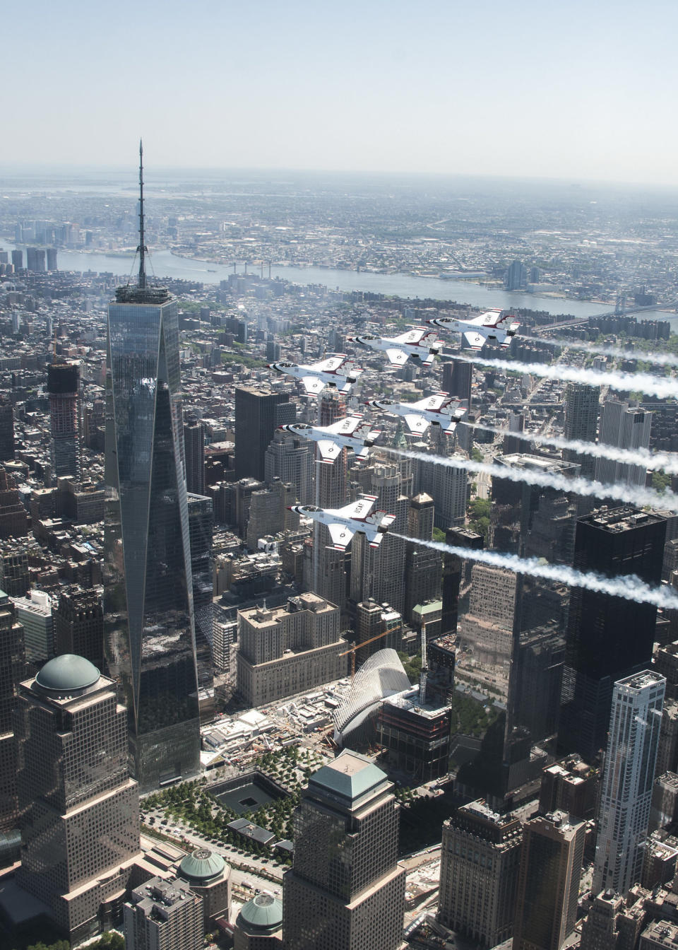 The Thunderbirds Delta formation flies by One World Trade Center during a photo chase mission in New York City May 22, 2015.