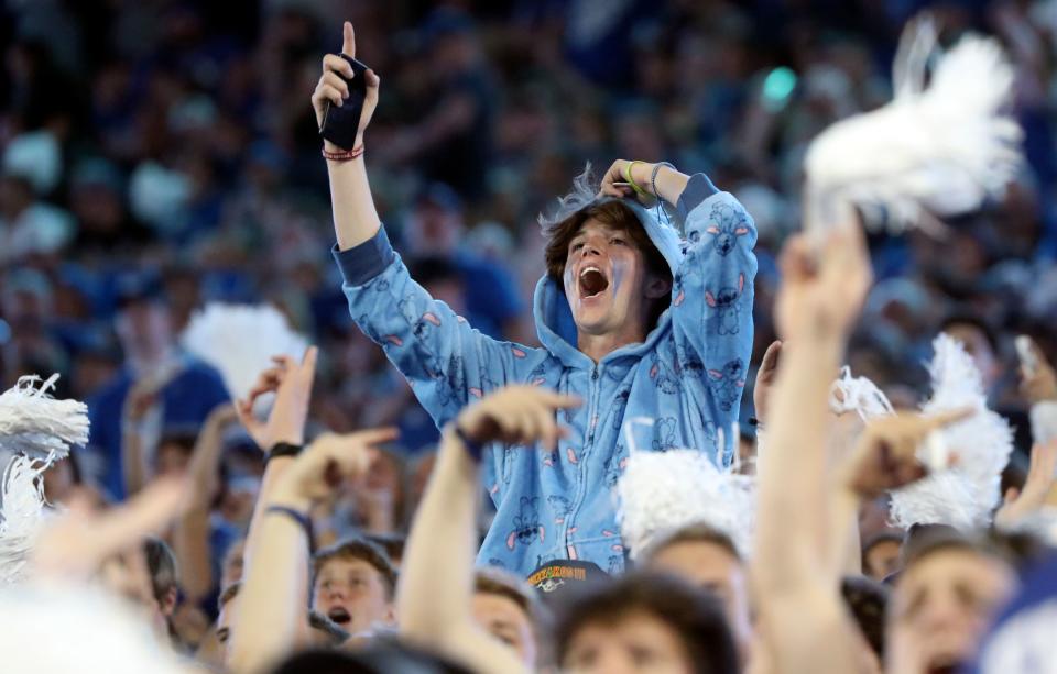 Fans cheer as the Brigham Young Cougars play the Cincinnati Bearcats in a football game at LaVell Edwards Stadium in Provo on Friday, Sept. 29, 2023. | Kristin Murphy, Deseret News