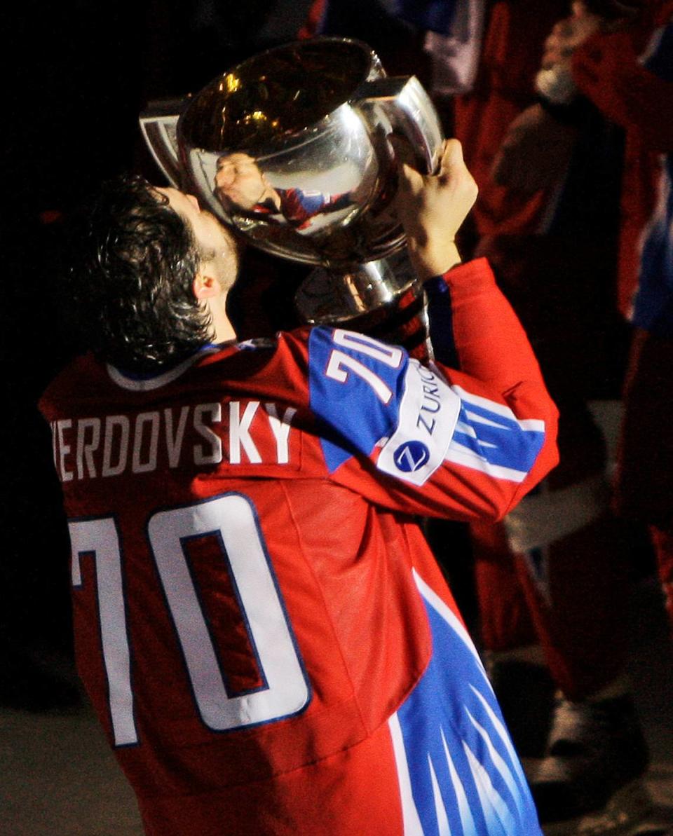 Russia’s Oleg Tverdovsky celebrates with the trophy after Russia beat Canada 2-1 in the final of the World Ice Hockey Championship match in Bern, Switzerland, Sunday, May 10, 2009. (AP Photo/Anja Niedringhaus)