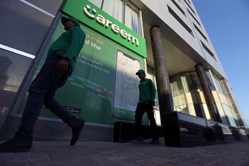 FILE PHOTO: Careem employees walk past the company's headquarters in Dubai, UAE
