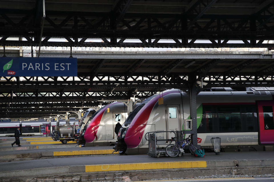 A man walks on a platform at the Gare de l'Est train station Monday, Dec. 23, 2019 in Paris. France's punishing transportation troubles may ease up slightly over Christmas, but unions plan renewed strikes and protests in January to resist government plans to raise the retirement age to 64. (AP Photo/Francois Mori)