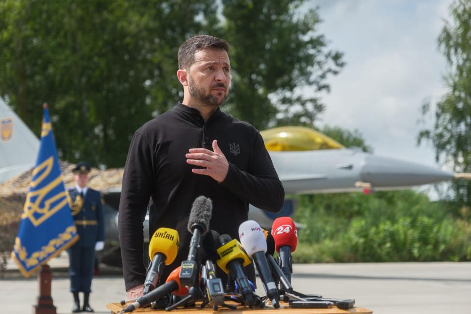 Ukrainian President Volodymyr Zelenskyi in front of the first F-16 fighter jets received by Ukraine on August 4, 2024.