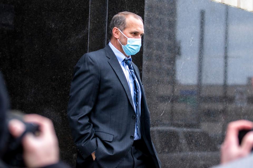 Former Macomb County prosecutor Eric Smith walks outside the United States District Court in Detroit on Feb. 16, 2022. Smith was sentenced for stealing money from his campaign fund.