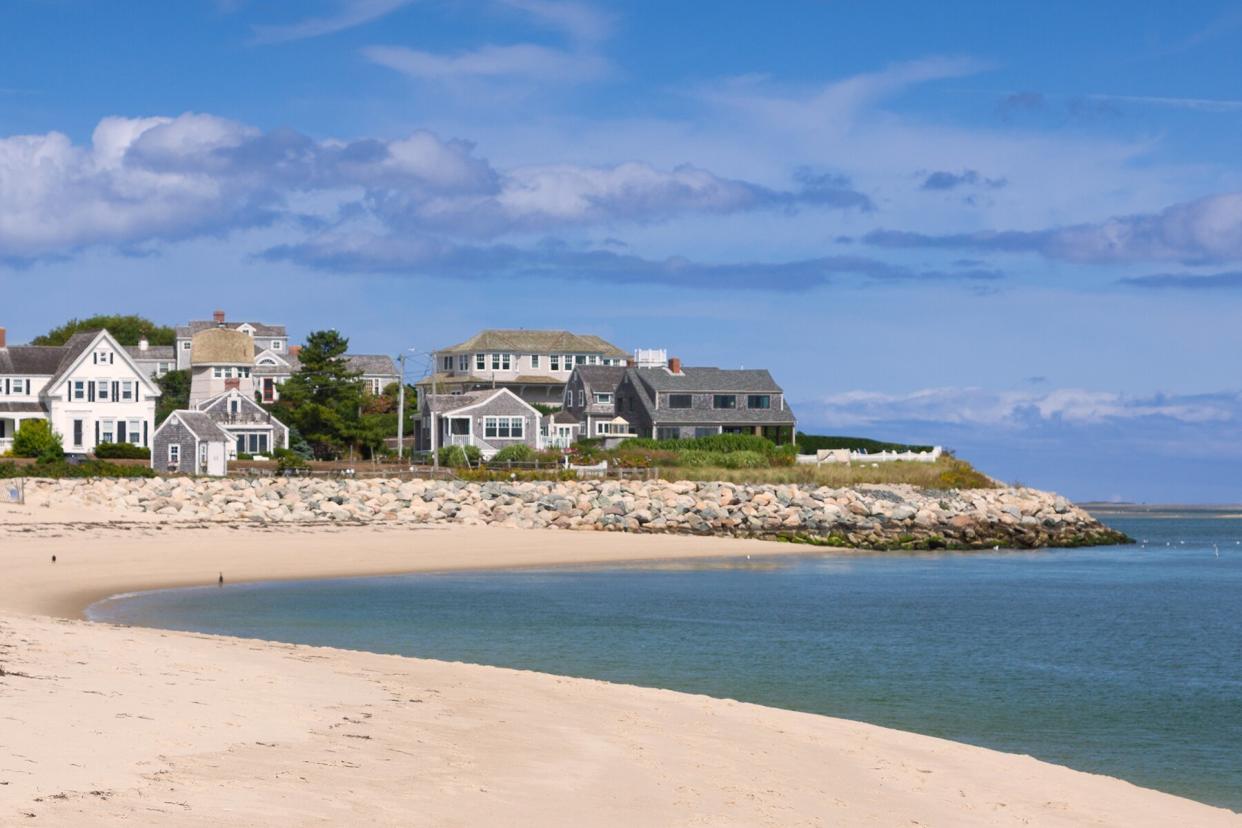 Harbor view, Cape Cod seashore with white sand beach & homes in Chatham