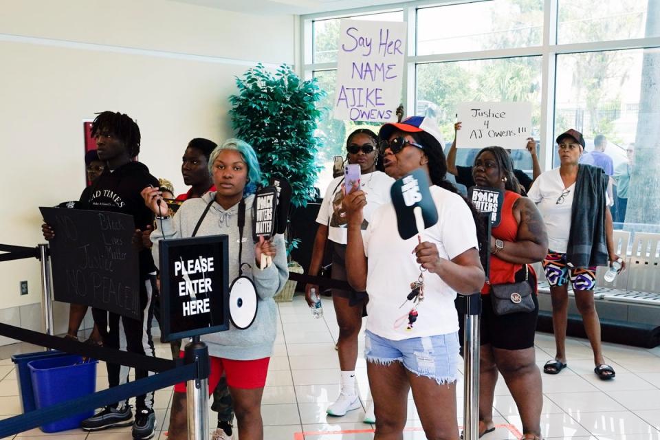 Protesters gather in the lobby of the Marion County Courthouse (AP)