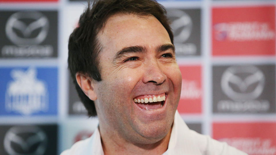 Pictured here, former North Melbourne coach Brad Scott's role with the AFL is set to change.