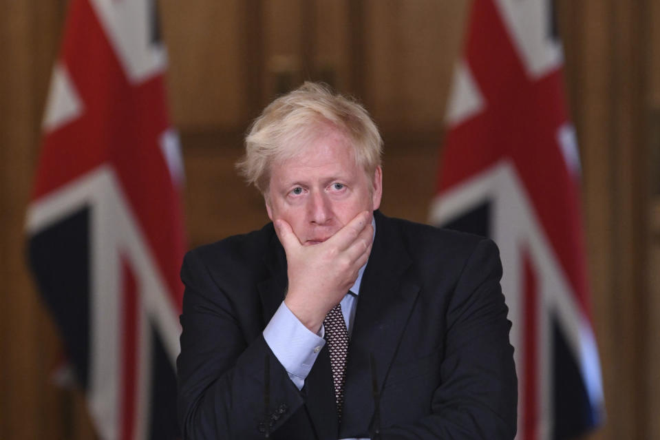 Britain's Prime Minister Boris Johnson speaks during a virtual press conference at Downing Street, London, Wednesday Sept. 9, 2020, following the announcement that the legal limit on social gatherings is set to be reduced from 30 people to six. The change in England will come into force on Monday as the Government seeks to curb the rise in coronavirus cases. (Stefan Rousseau/Pool via AP)